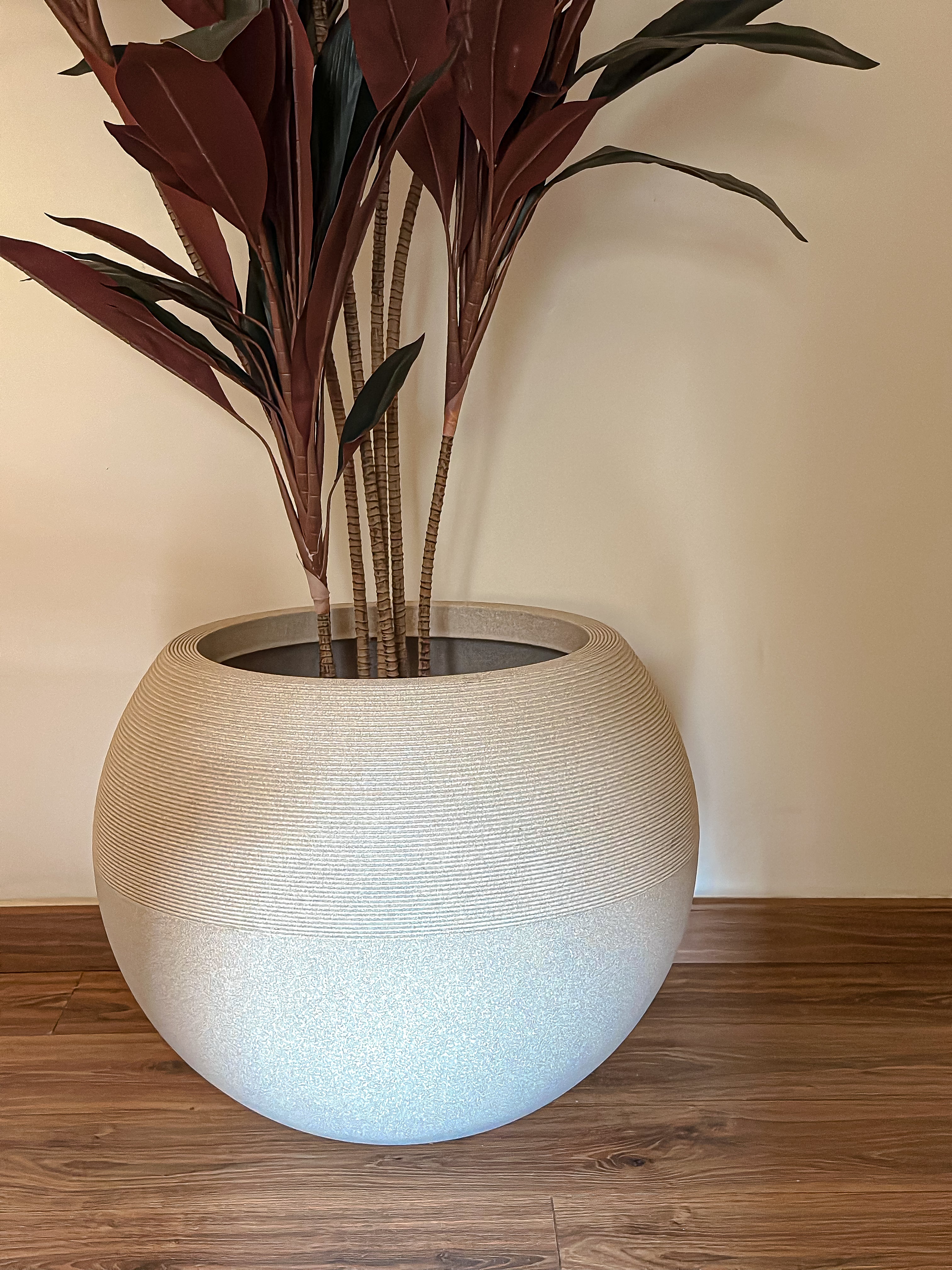 Rounded fiber glass plant pot