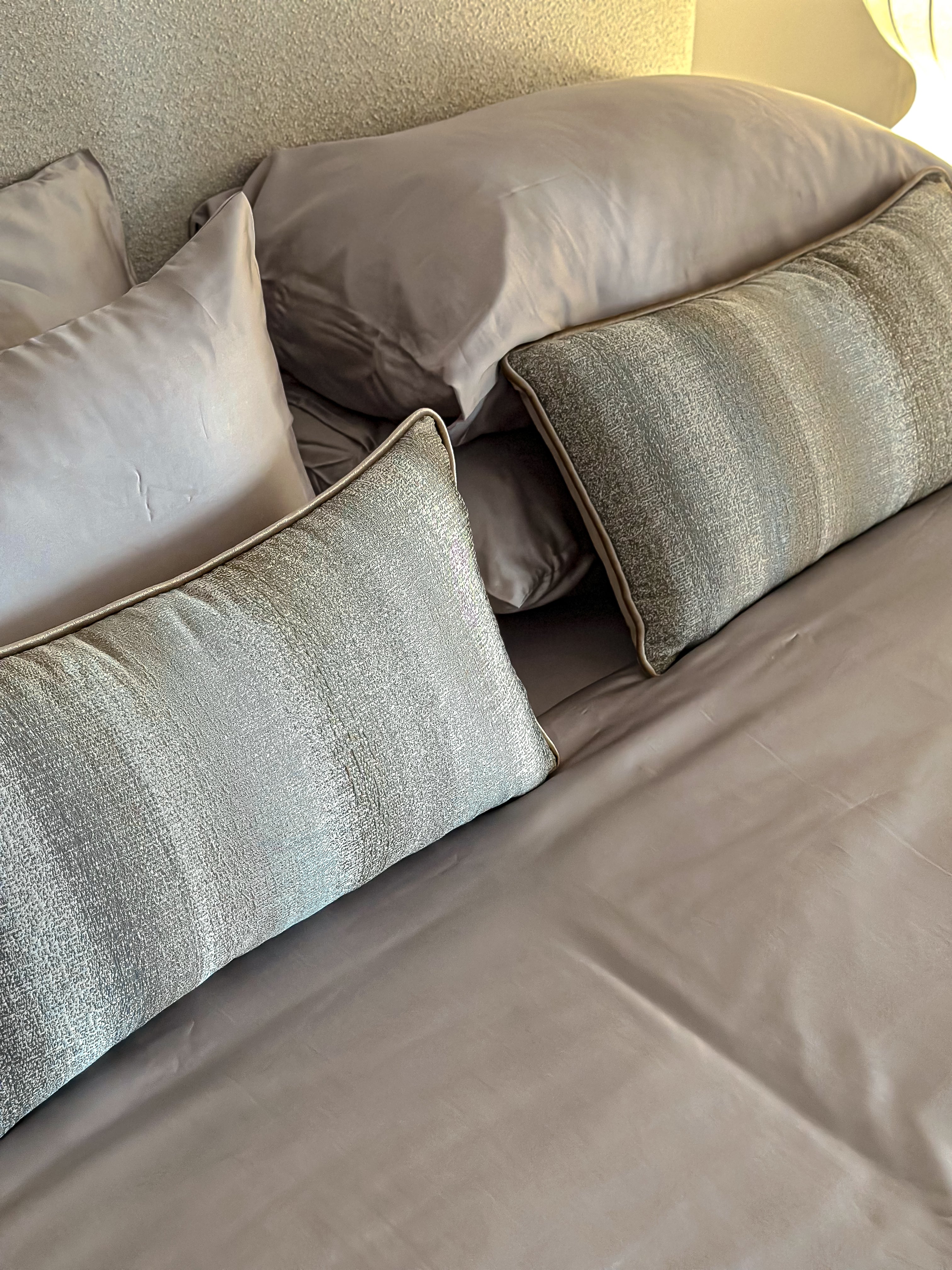 Linear greige cushion