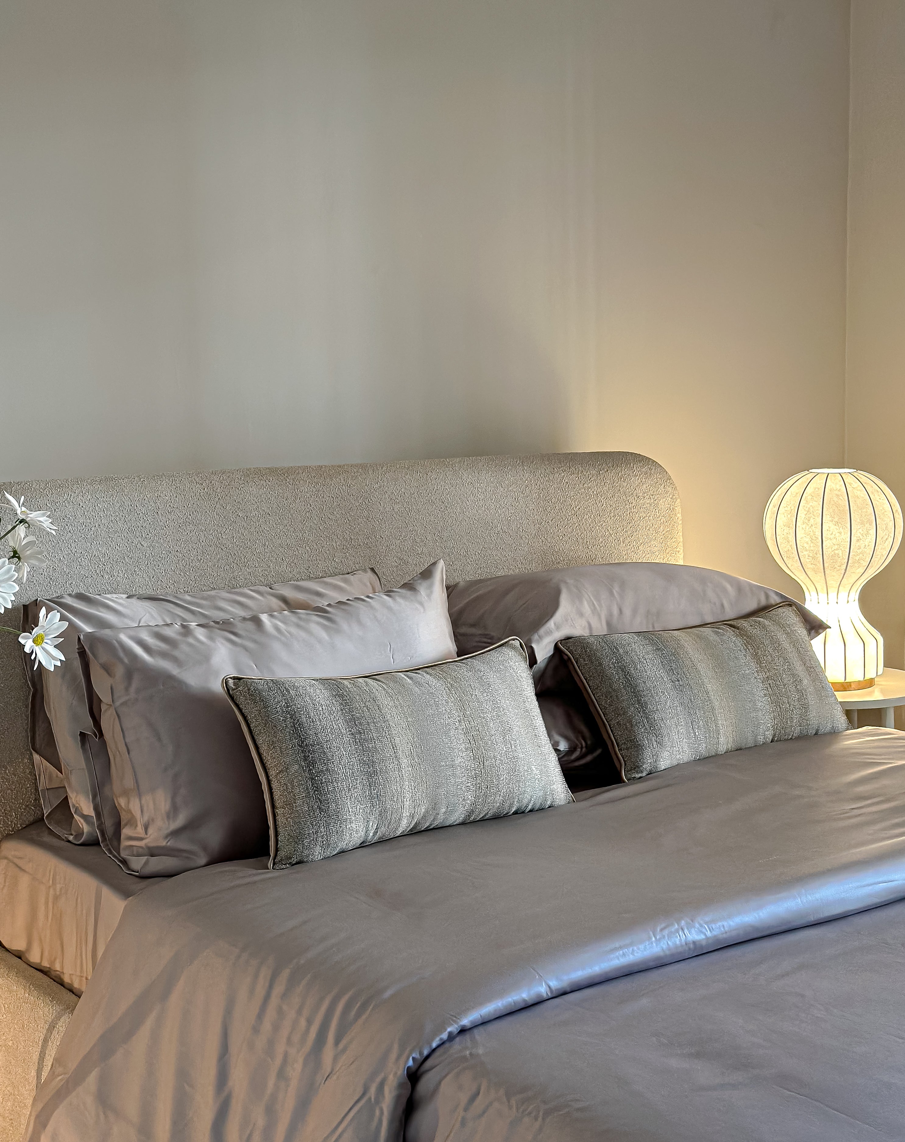 Linear greige cushion