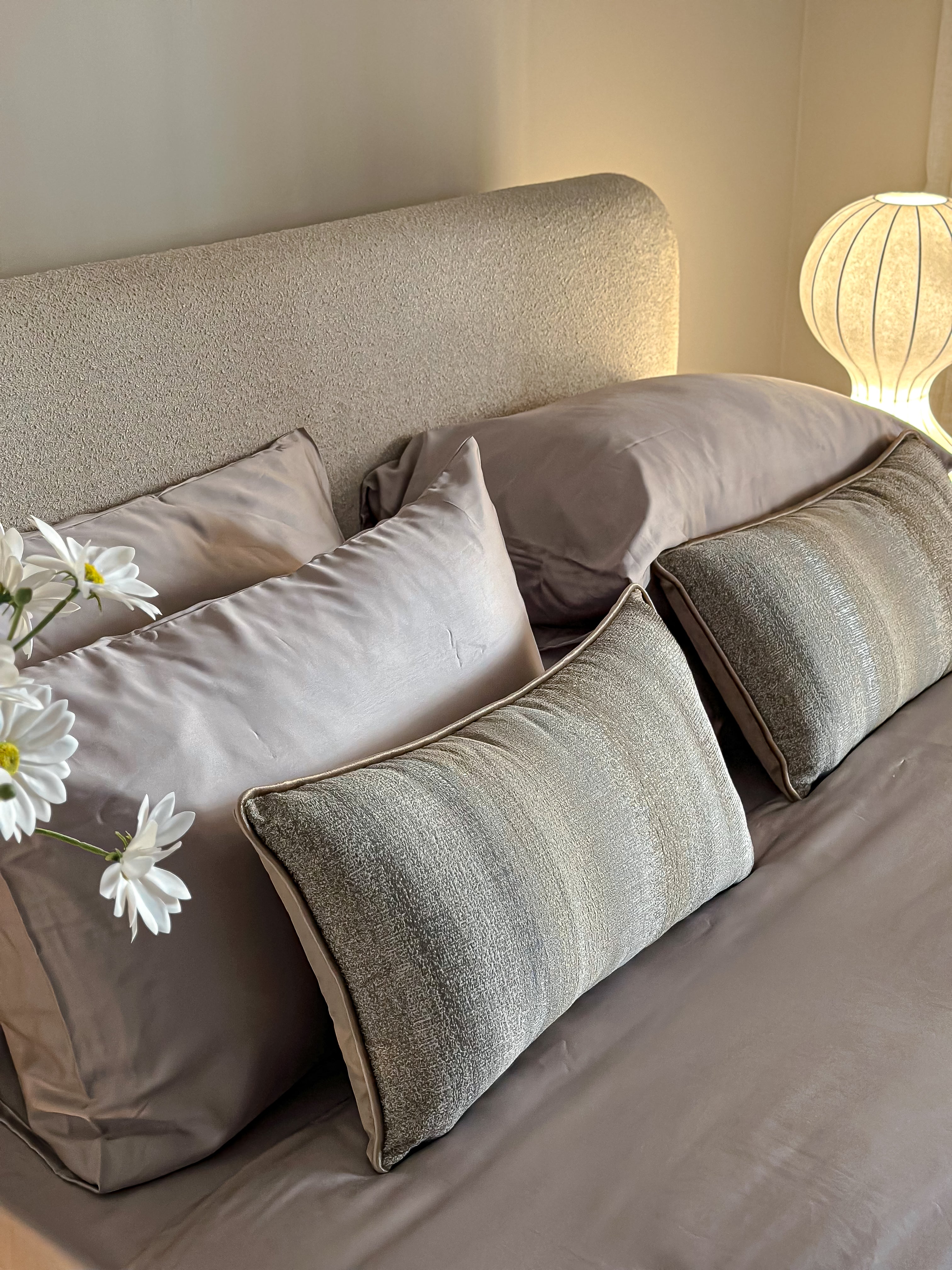 Linear greige cushion